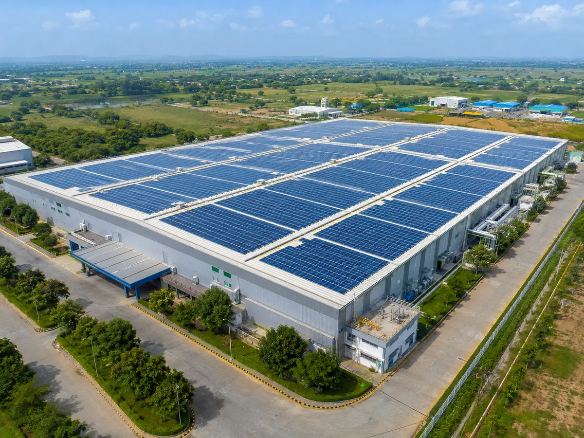 Industrial factory rooftop covered with solar panels